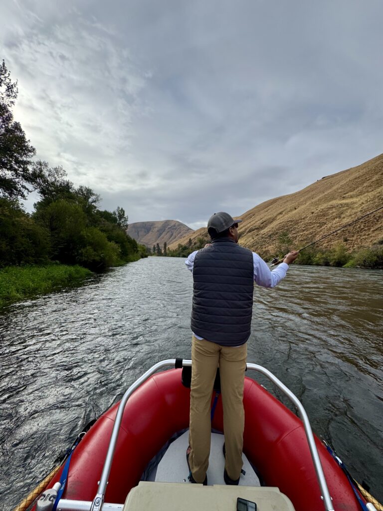 Fly fishing from a drift boat on the Yakima River.